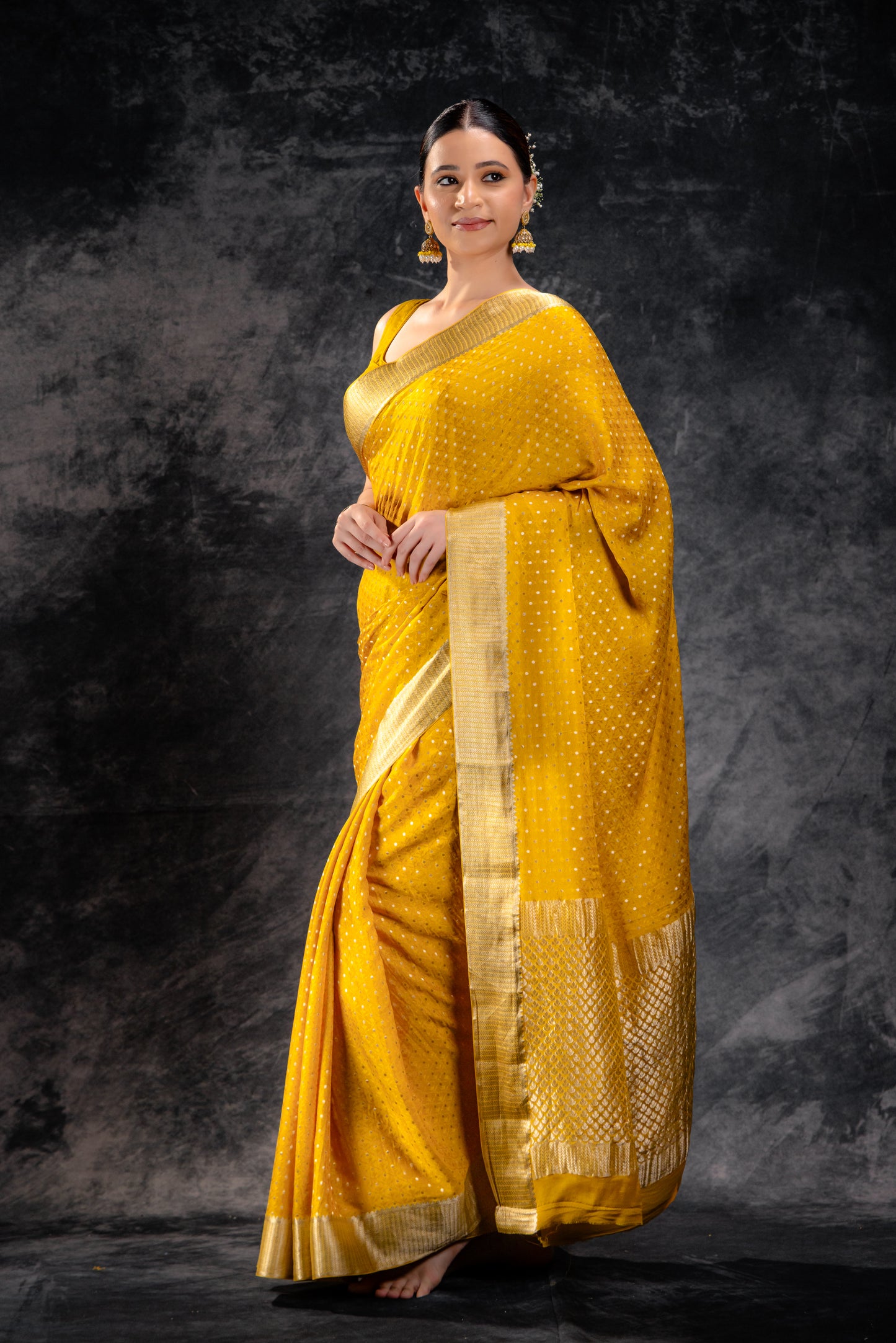 Mustard Yellow Crepe Saree with Silver Zari Buttas and Floral Jaal Texture