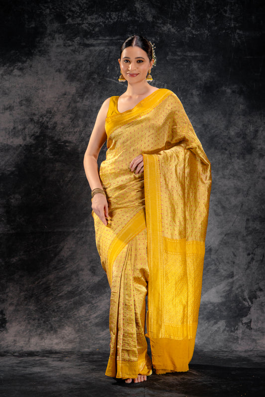Mustard Crepe Silk Saree with Rani Meena Buttas and Diagonal Zari Weave
