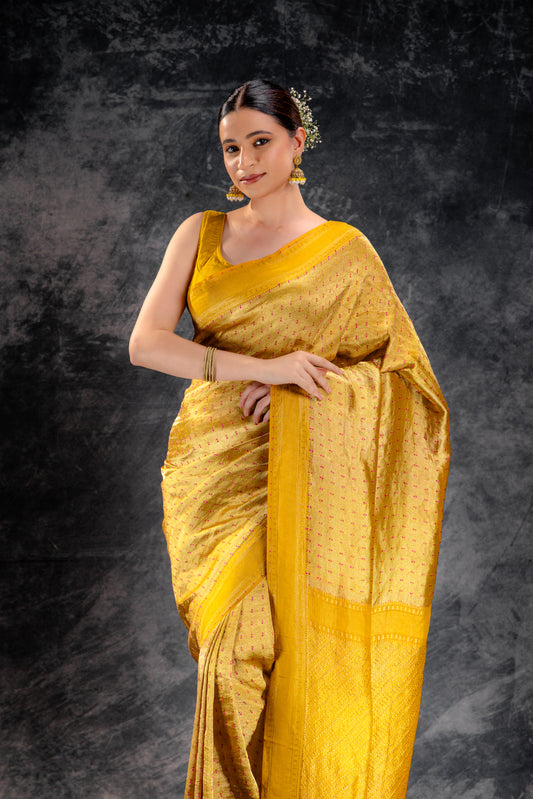 Mustard Crepe Silk Saree with Rani Meena Buttas and Diagonal Zari Weave