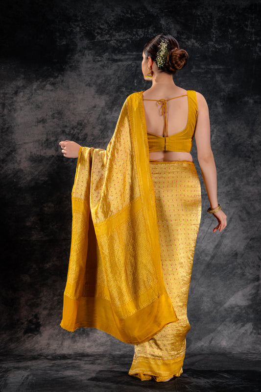 Mustard Crepe Silk Saree with Rani Meena Buttas and Diagonal Zari Weave