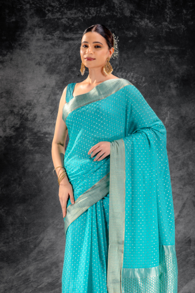 Teal Blue Crepe Saree with Silver Buttas & Floral Jaal Texture