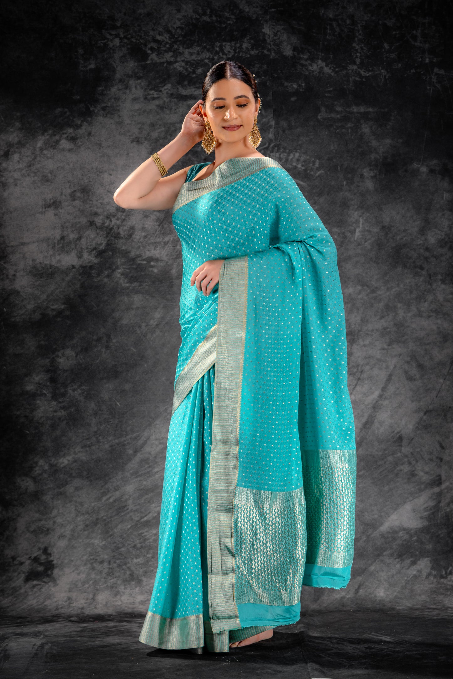 Teal Blue Crepe Saree with Silver Buttas & Floral Jaal Texture