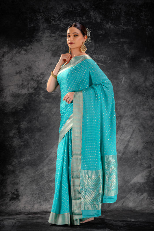 Teal Blue Crepe Saree with Silver Buttas & Floral Jaal Texture
