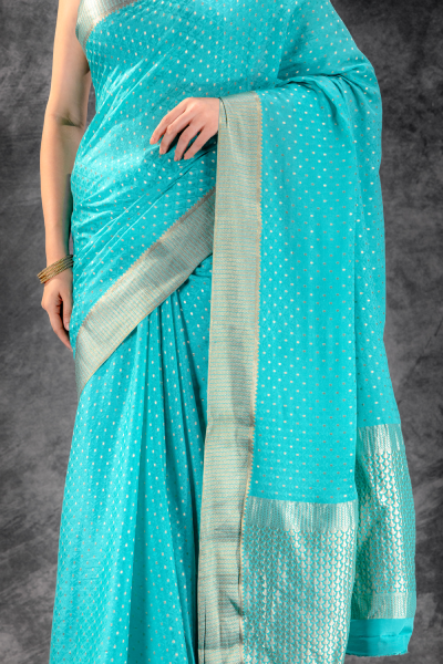 Teal Blue Crepe Saree with Silver Buttas & Floral Jaal Texture