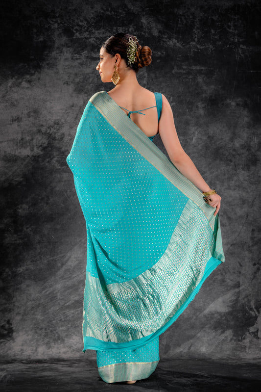 Teal Blue Crepe Saree with Silver Buttas & Floral Jaal Texture