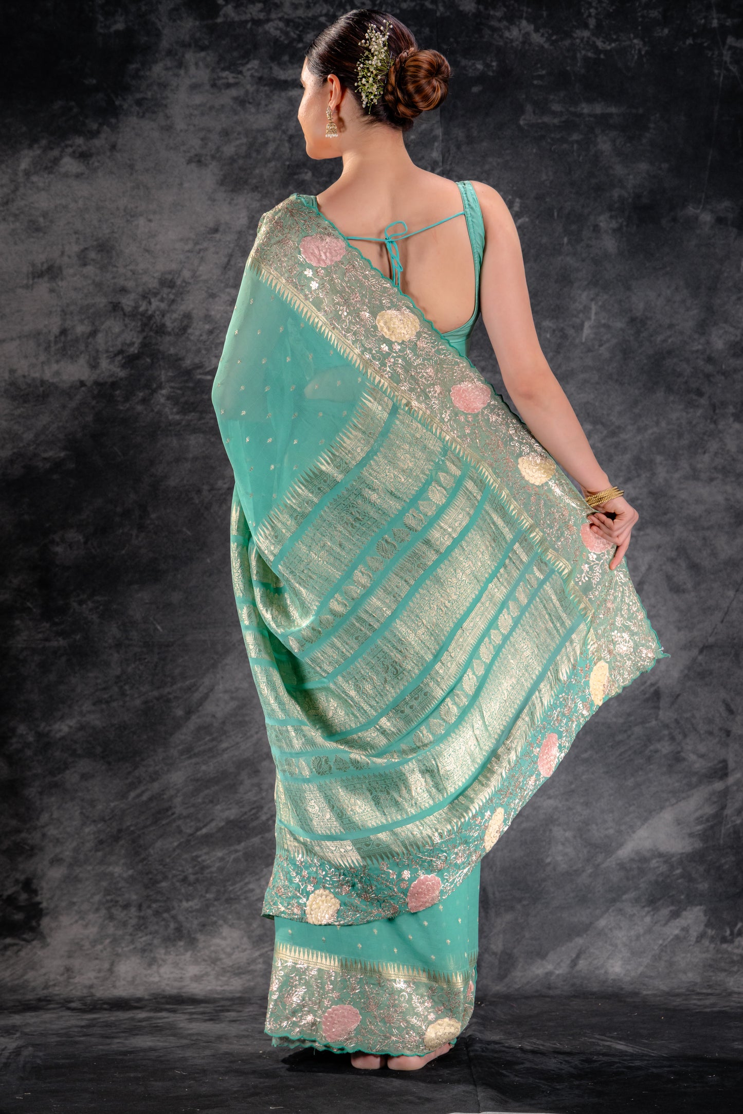 Meadow Green Georgette Saree with Zari Buttas and Embroidered Border