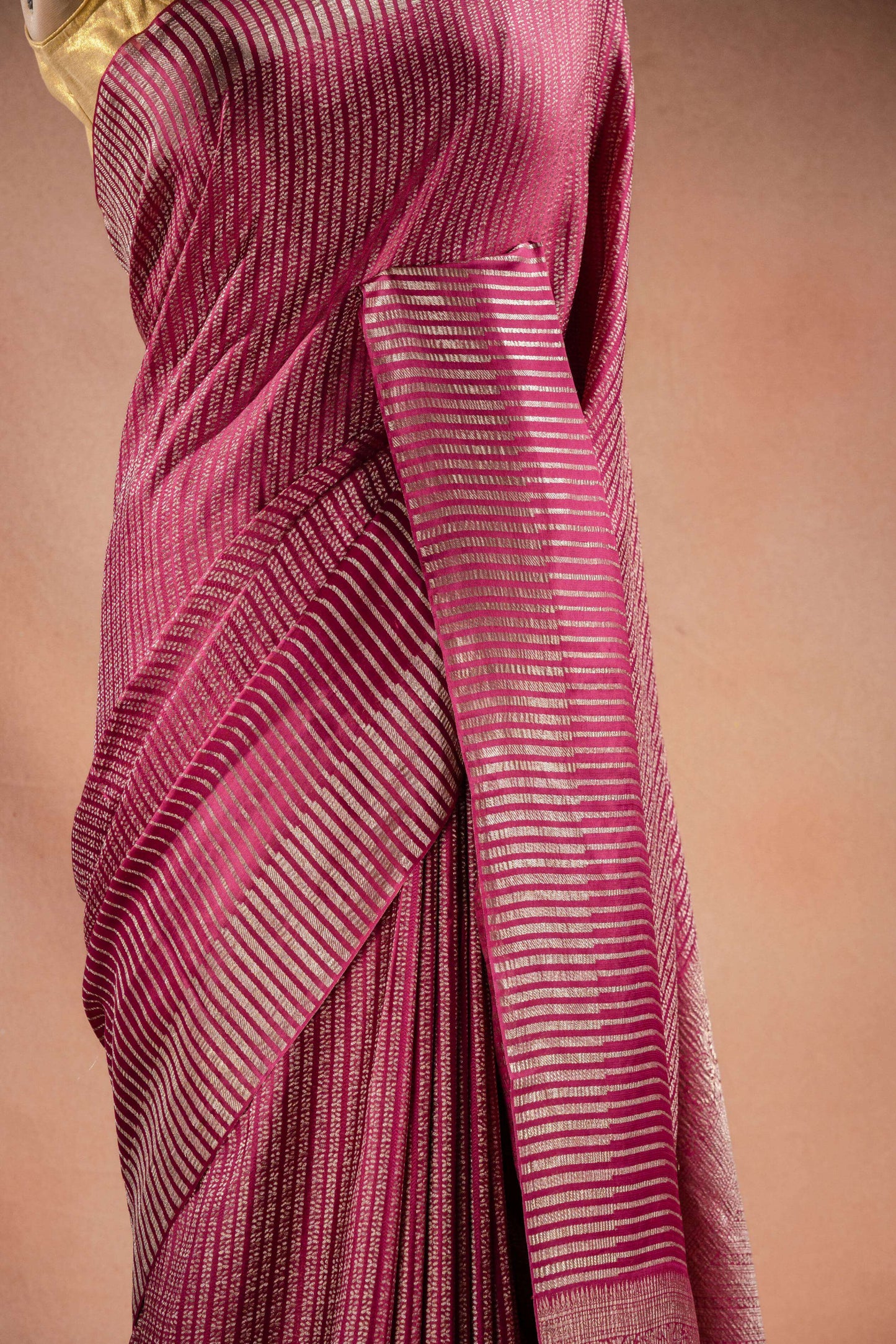 Pink Crepe Silk Saree with Zari Stripes draped elegantly showcasing its fine zari stripe weaving.