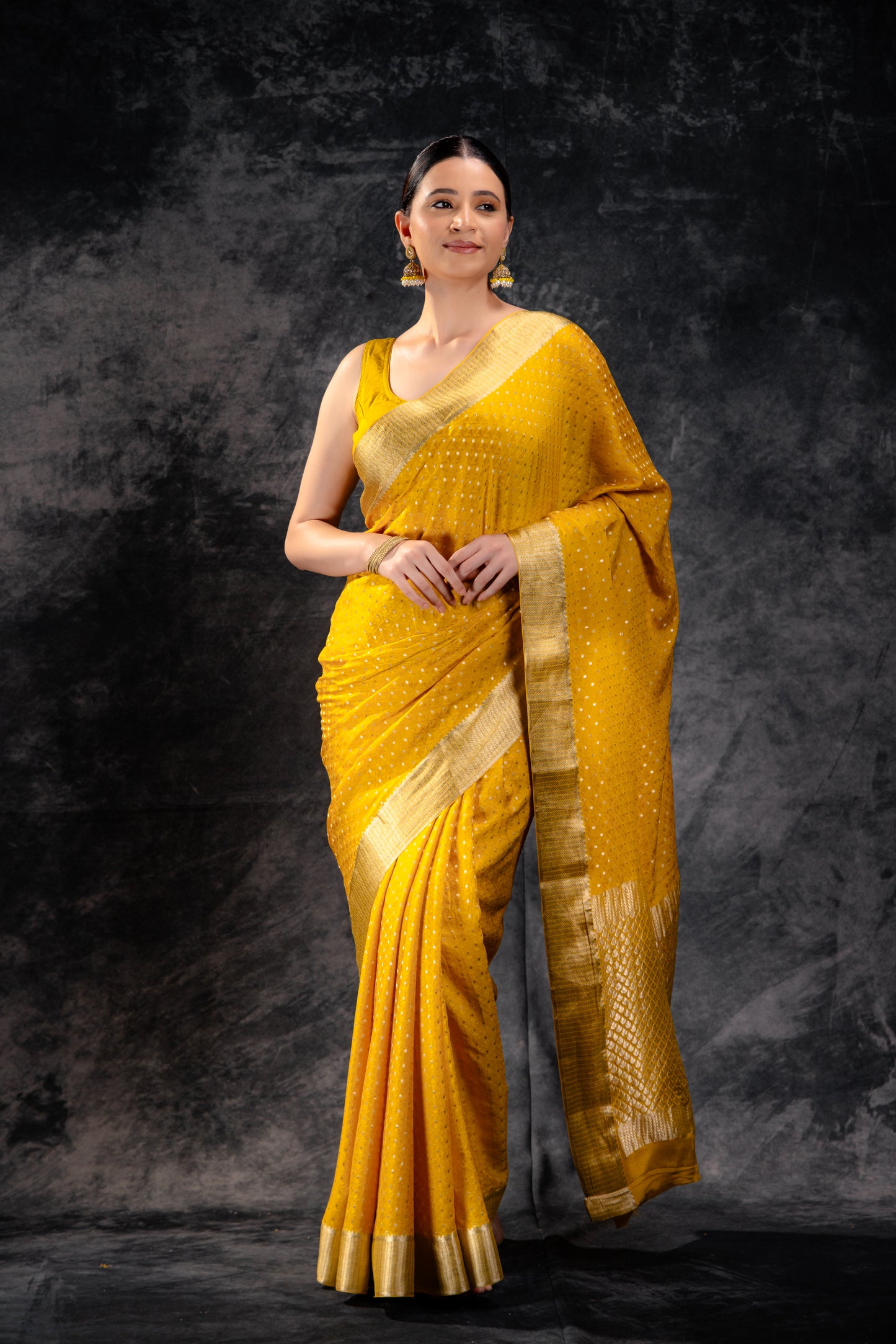 Mustard Yellow Crepe Saree with Silver Zari Buttas and Floral Jaal Texture