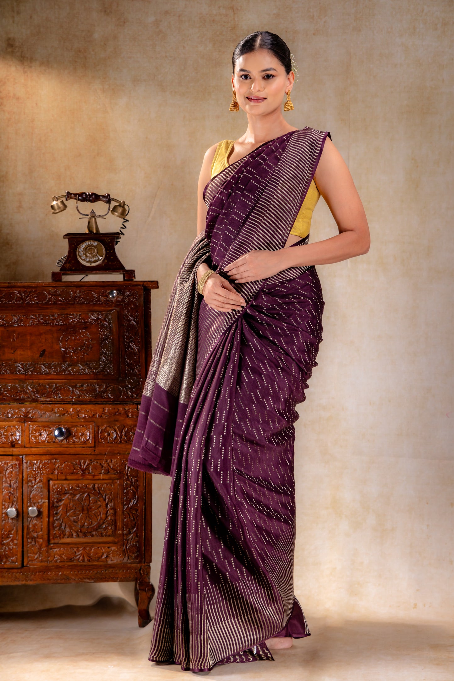 Plum Purple Crepe Saree with Vertical Zari Dots and Contemporary Striped Border