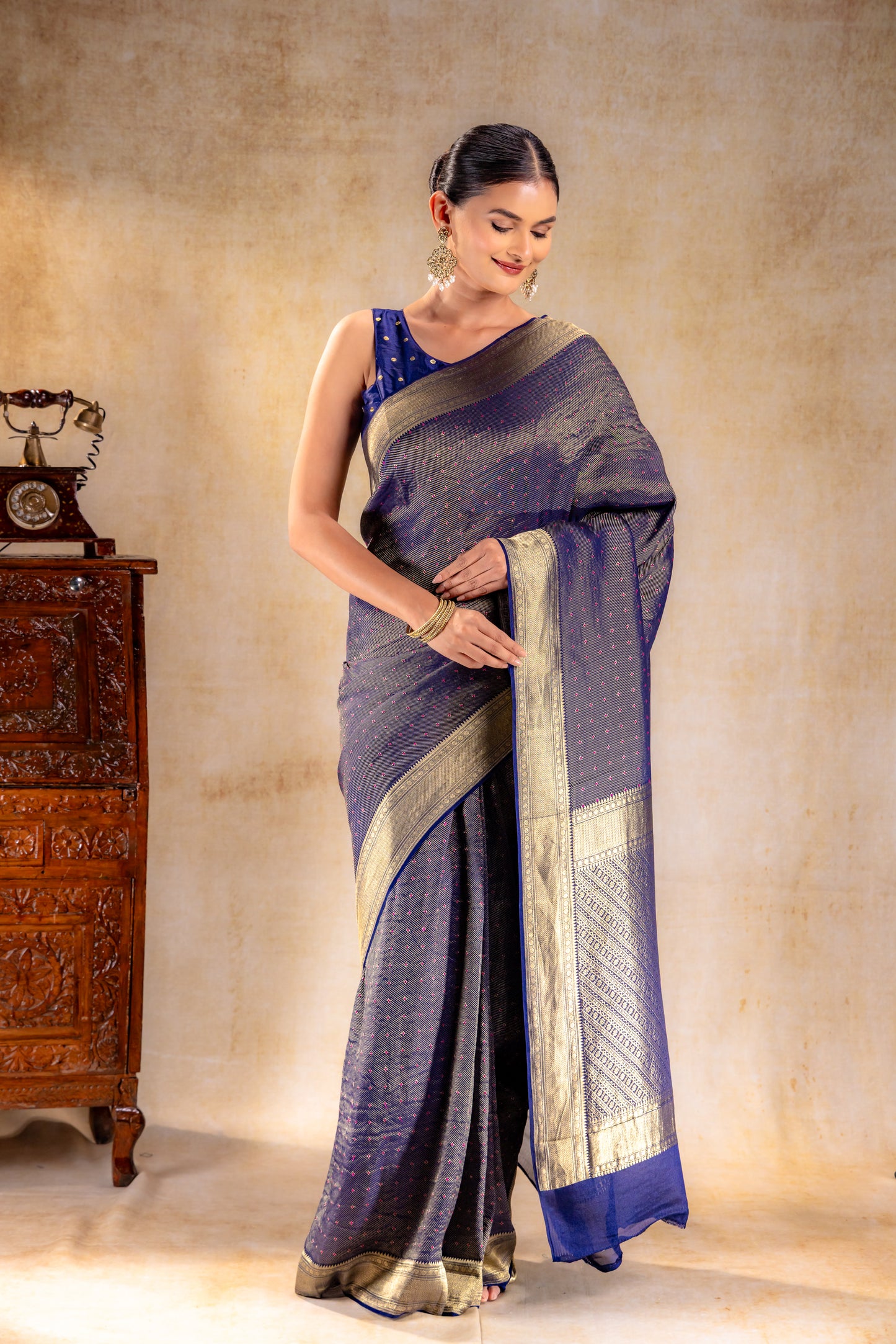Royal Indigo Crepe Silk Saree with Rani Meena Buttas and Diagonal Zari Weave