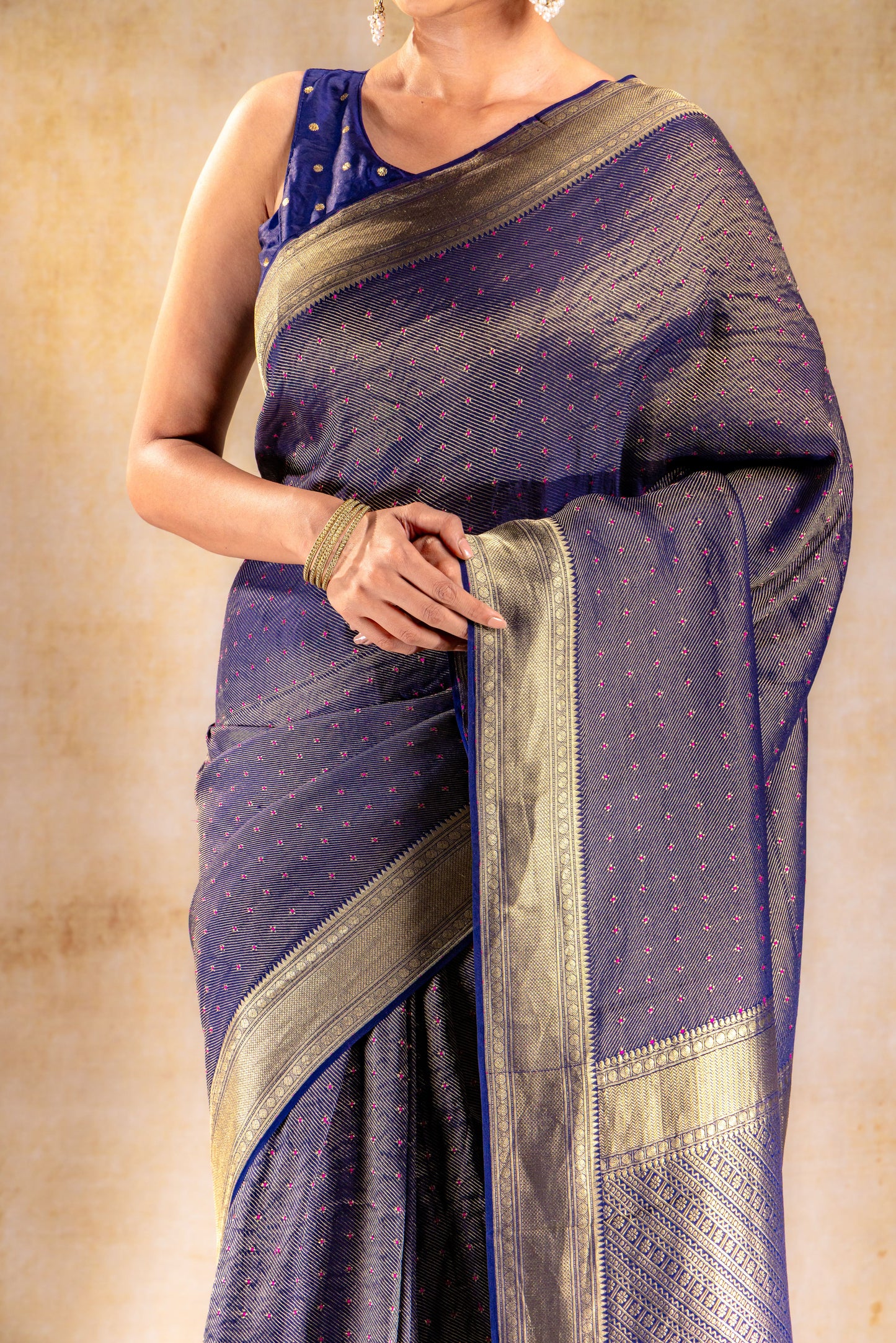 Royal Indigo Crepe Silk Saree with Rani Meena Buttas and Diagonal Zari Weave