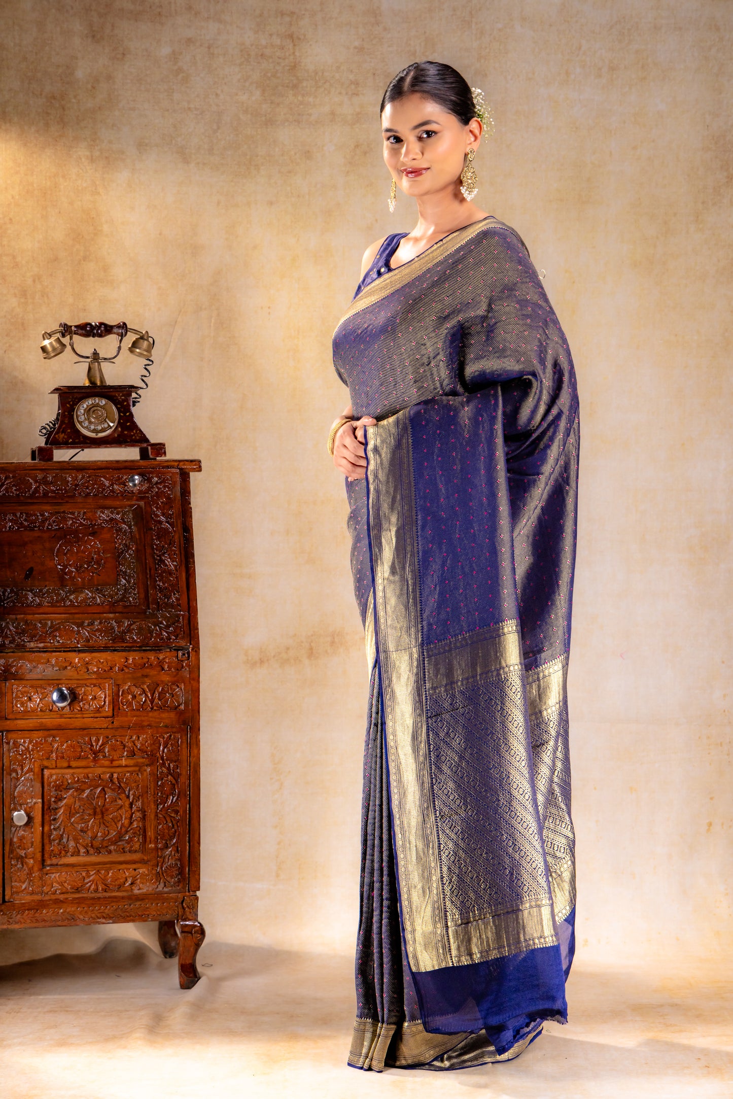 Royal Indigo Crepe Silk Saree with Rani Meena Buttas and Diagonal Zari Weave