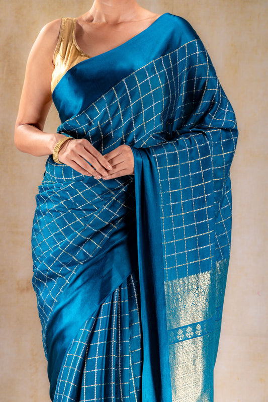 Peacock Teal Crepe Saree with Gold-Silver Check Lines with Satin Border