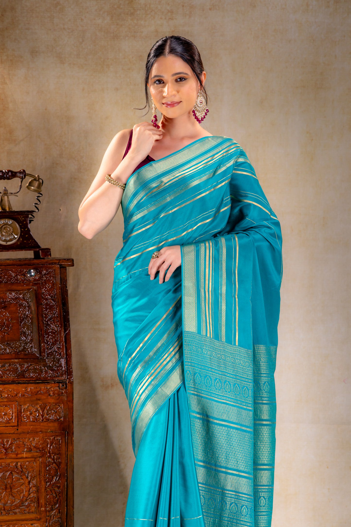 Teal Blue Crepe Saree Gold Zari Rich Border