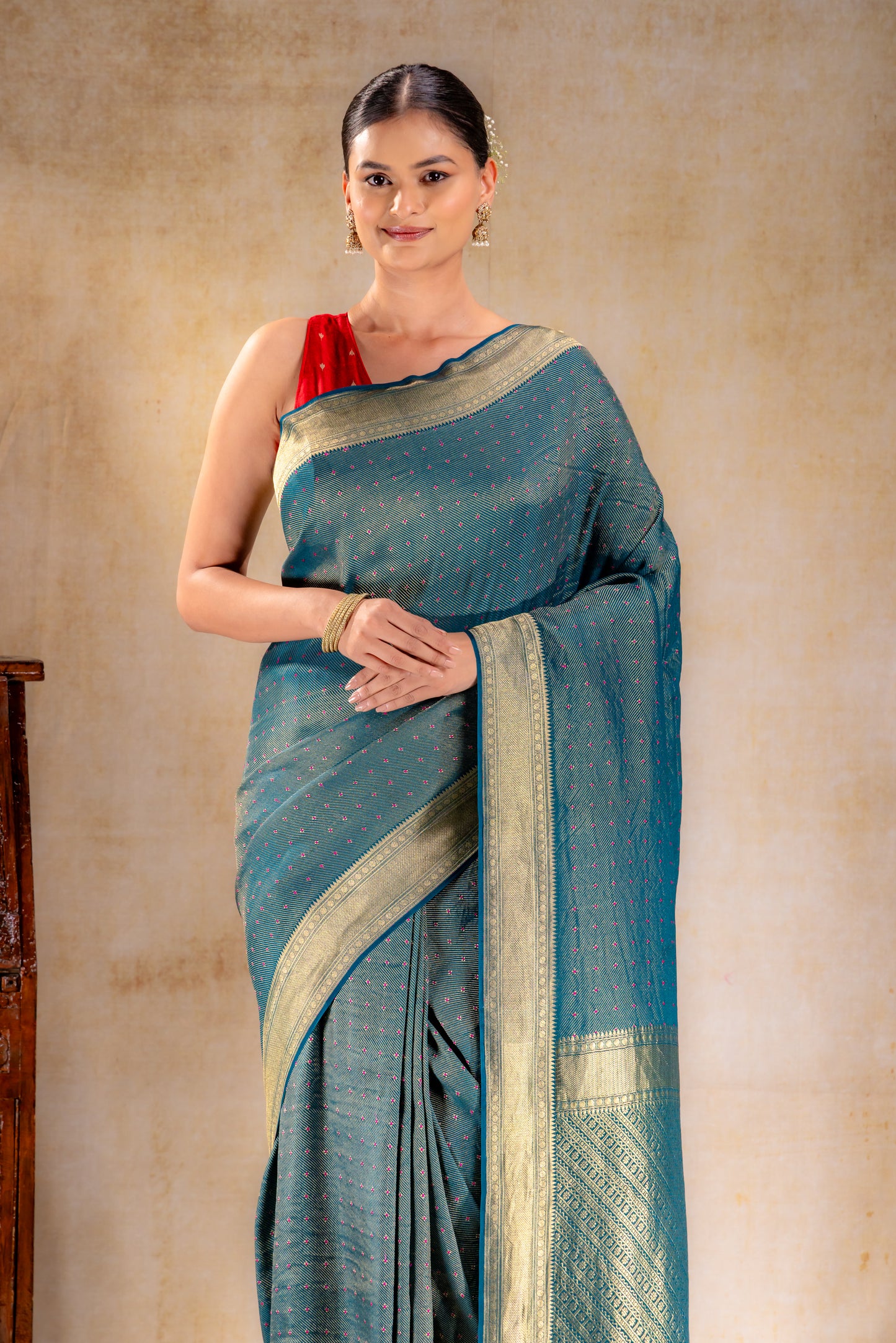Peacock Teal Crepe Silk Saree with Rani Meena Buttas and Diagonal Zari Weave