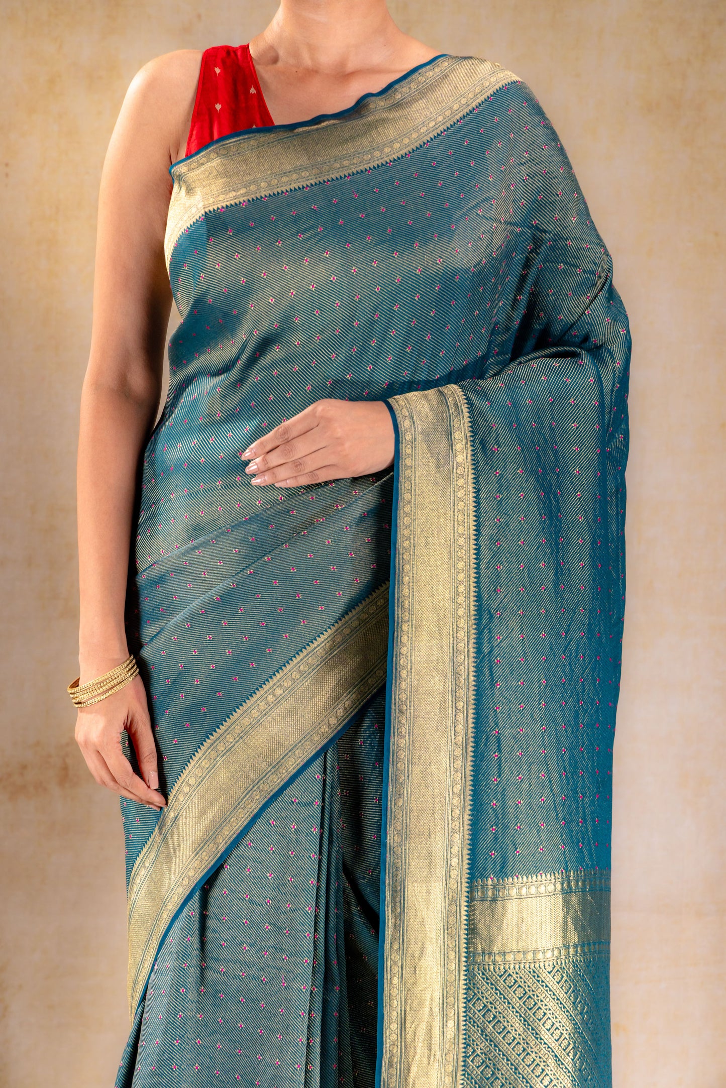 Peacock Teal Crepe Silk Saree with Rani Meena Buttas and Diagonal Zari Weave