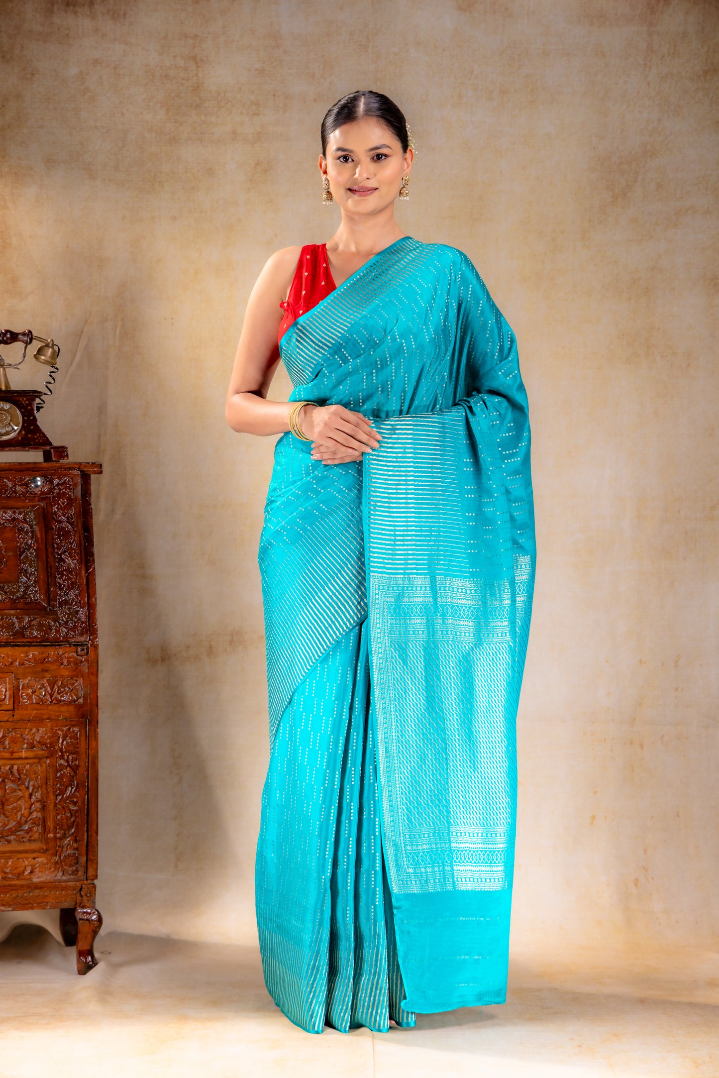 Peacock Blue Crepe Saree with Silver Vertical Buttas and Striking Zari Border