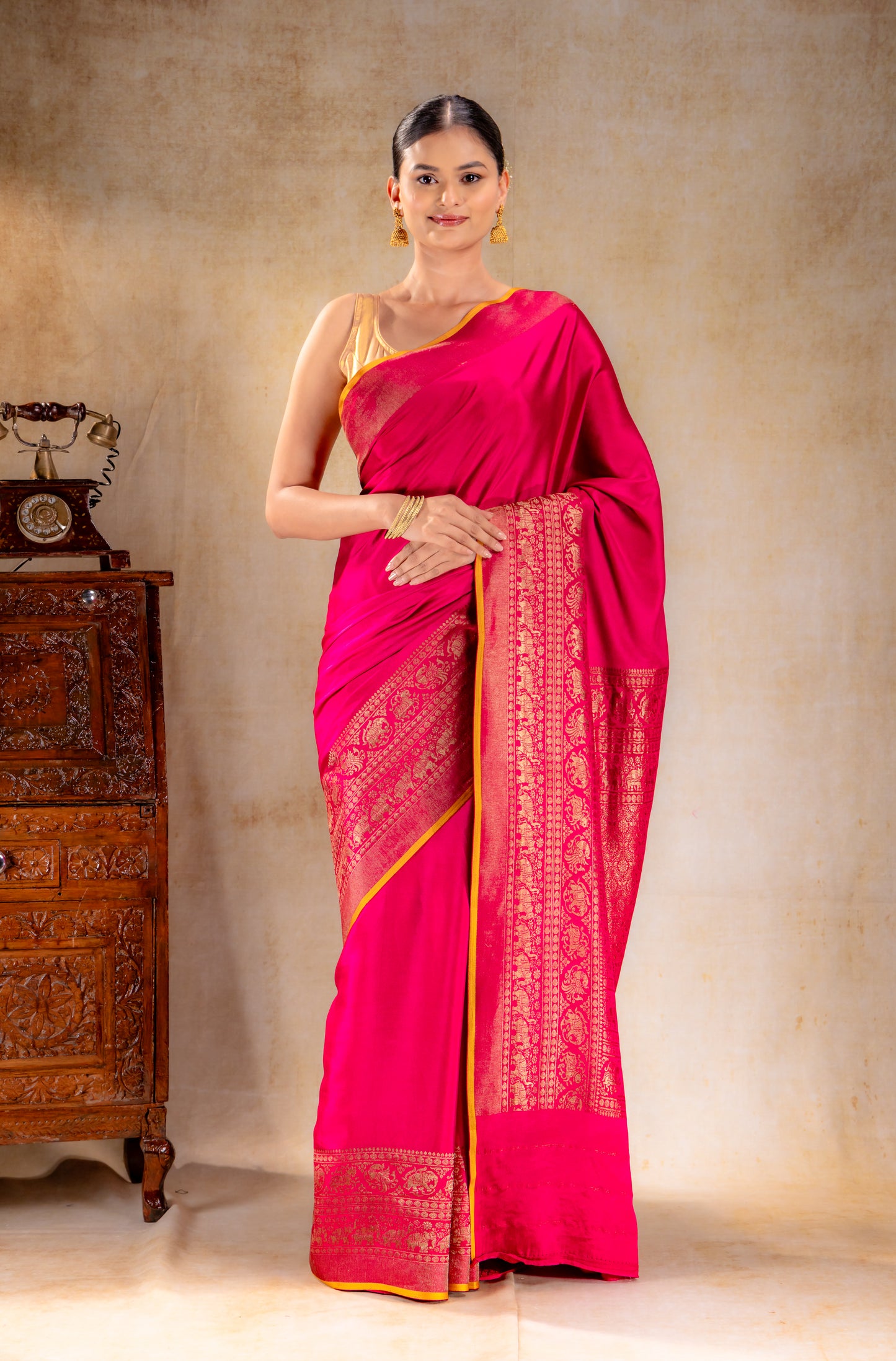Rani Pink Crepe Silk Saree with Antique Zari Elephant Border