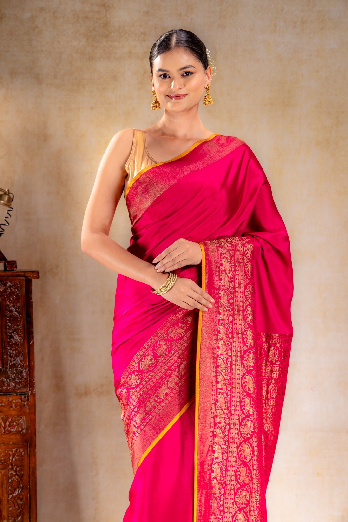 Rani Pink Crepe Silk Saree with Antique Zari Elephant Border