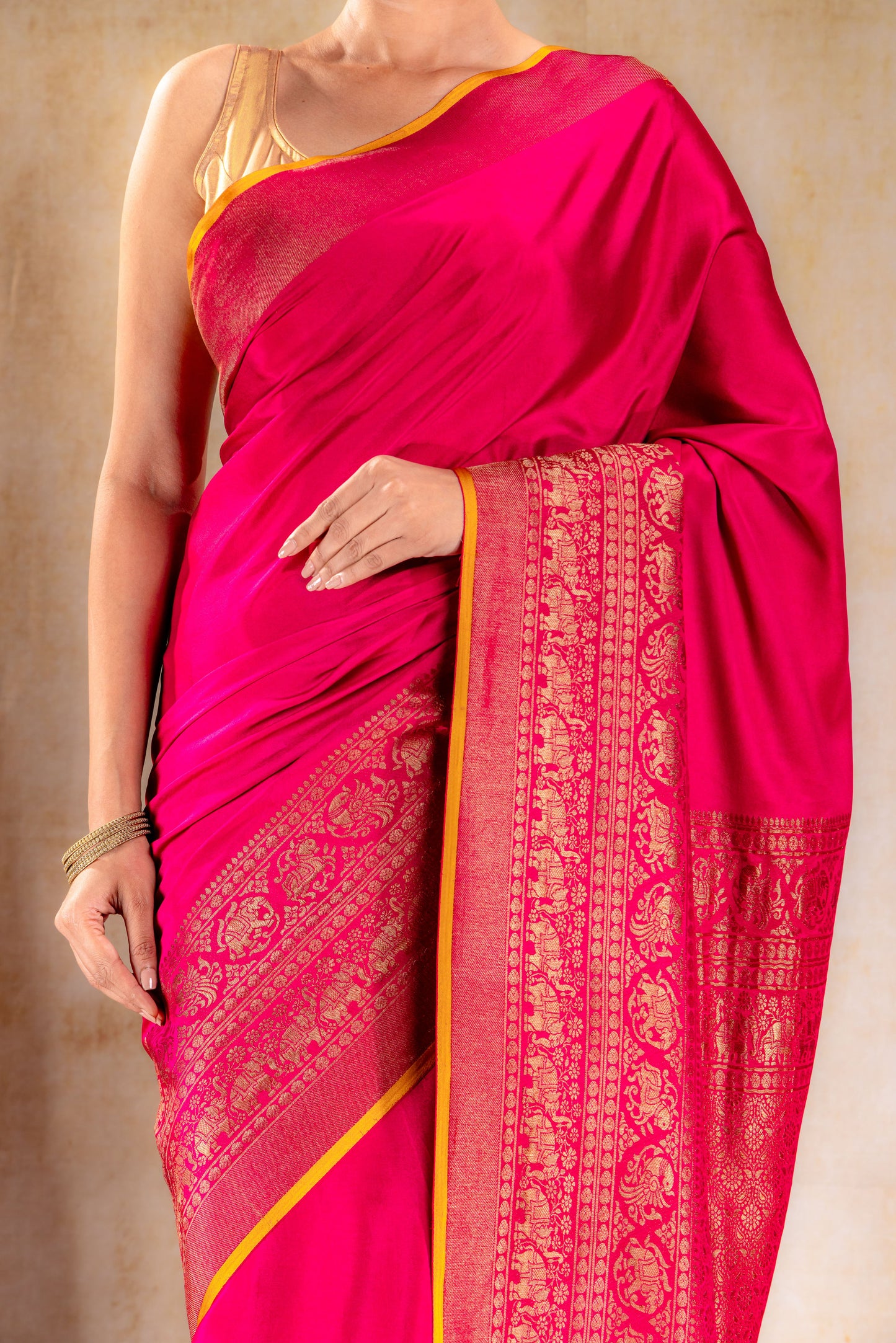 Rani Pink Crepe Silk Saree with Antique Zari Elephant Border