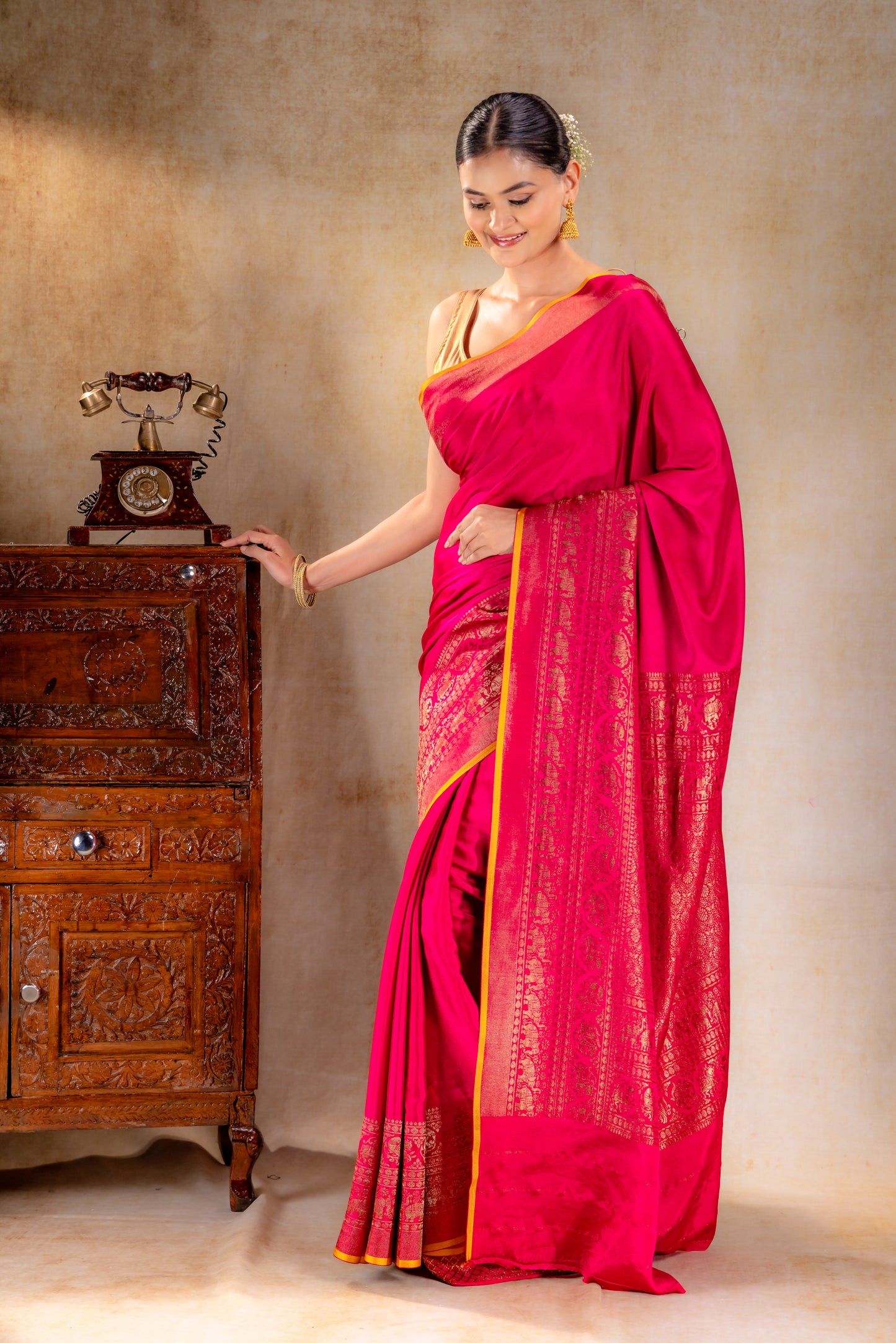 Rani Pink Crepe Silk Saree with Antique Zari Elephant Border