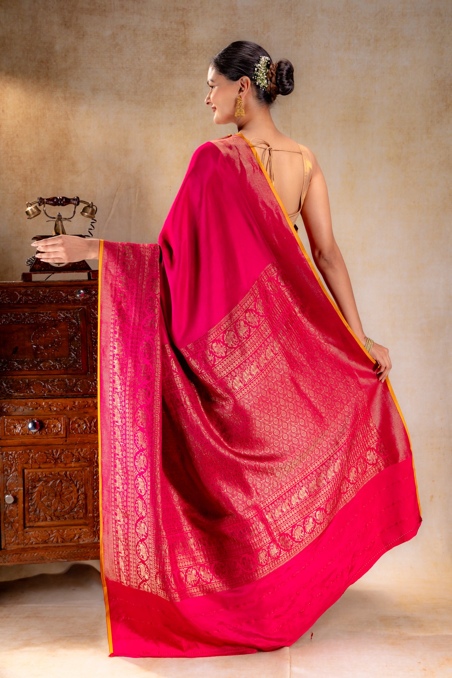 Rani Pink Crepe Silk Saree with Antique Zari Elephant Border