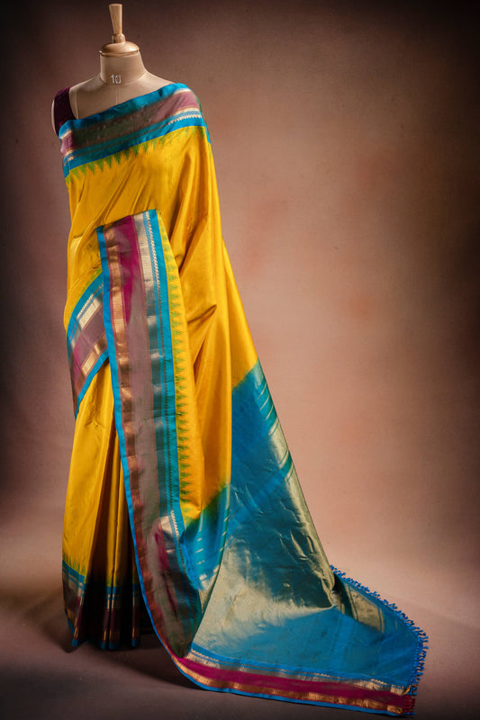 Gadwal Silk Yellow with Blue Border Saree