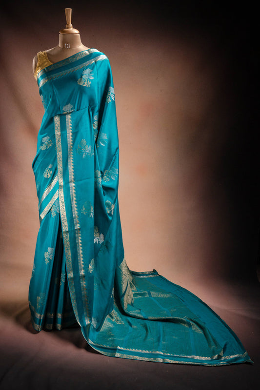 Teal Blue Crepe Silk Saree with Double Mispick Zari Roses