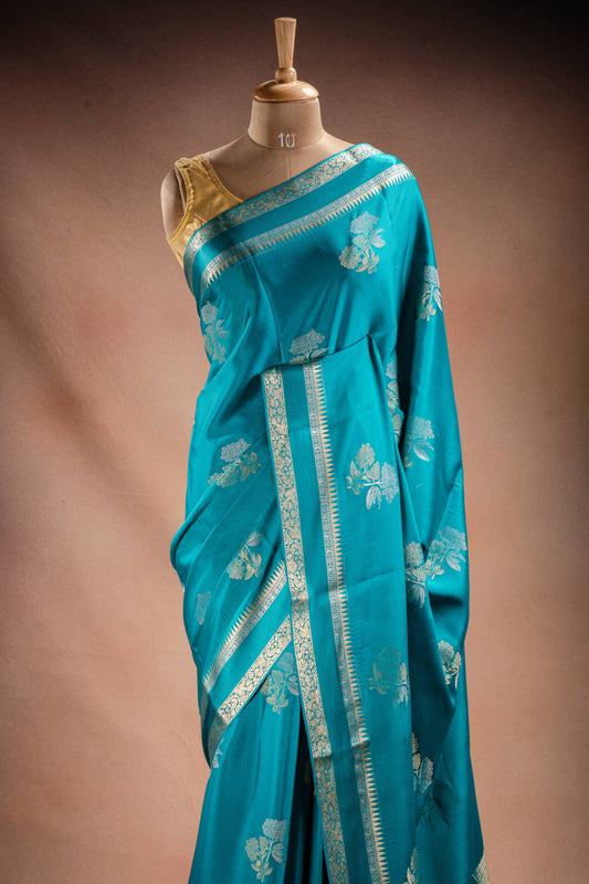 Teal Blue Crepe Silk Saree with Double Mispick Zari Roses