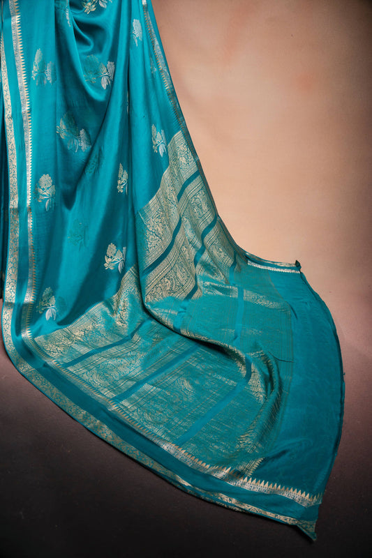 Teal Blue Crepe Silk Saree with Double Mispick Zari Roses