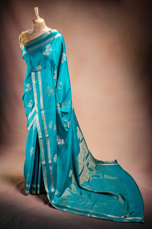 Teal Blue Crepe Silk Saree with Double Mispick Zari Roses