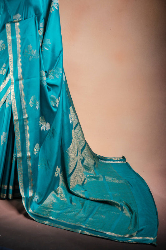 Teal Blue Crepe Silk Saree with Double Mispick Zari Roses
