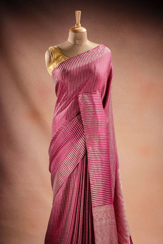 Pink Crepe Silk Saree with Zari Stripes elegantly draped, showcasing fine zari stripe weaving for festive occasions.