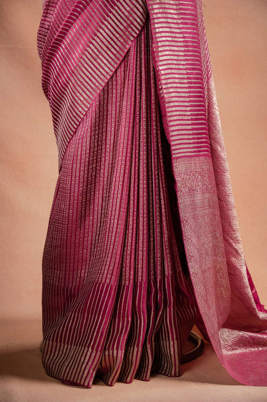 Pink Crepe Silk Saree with Zari Stripes elegantly draping in pink with fine zari stripes for special occasions.