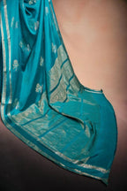 Teal Blue Crepe Silk Saree with Double Mispick Zari Roses that-saree-shop.myshopify.com